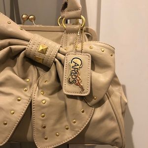 Nude bow clasp purse